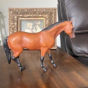 Breyer Rugged Lark Chestnut and Black Horse figurine.
